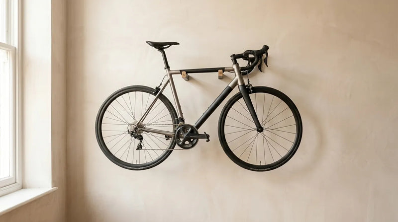 Bike hung on an oak wall mount on an apartment wall to save floor space