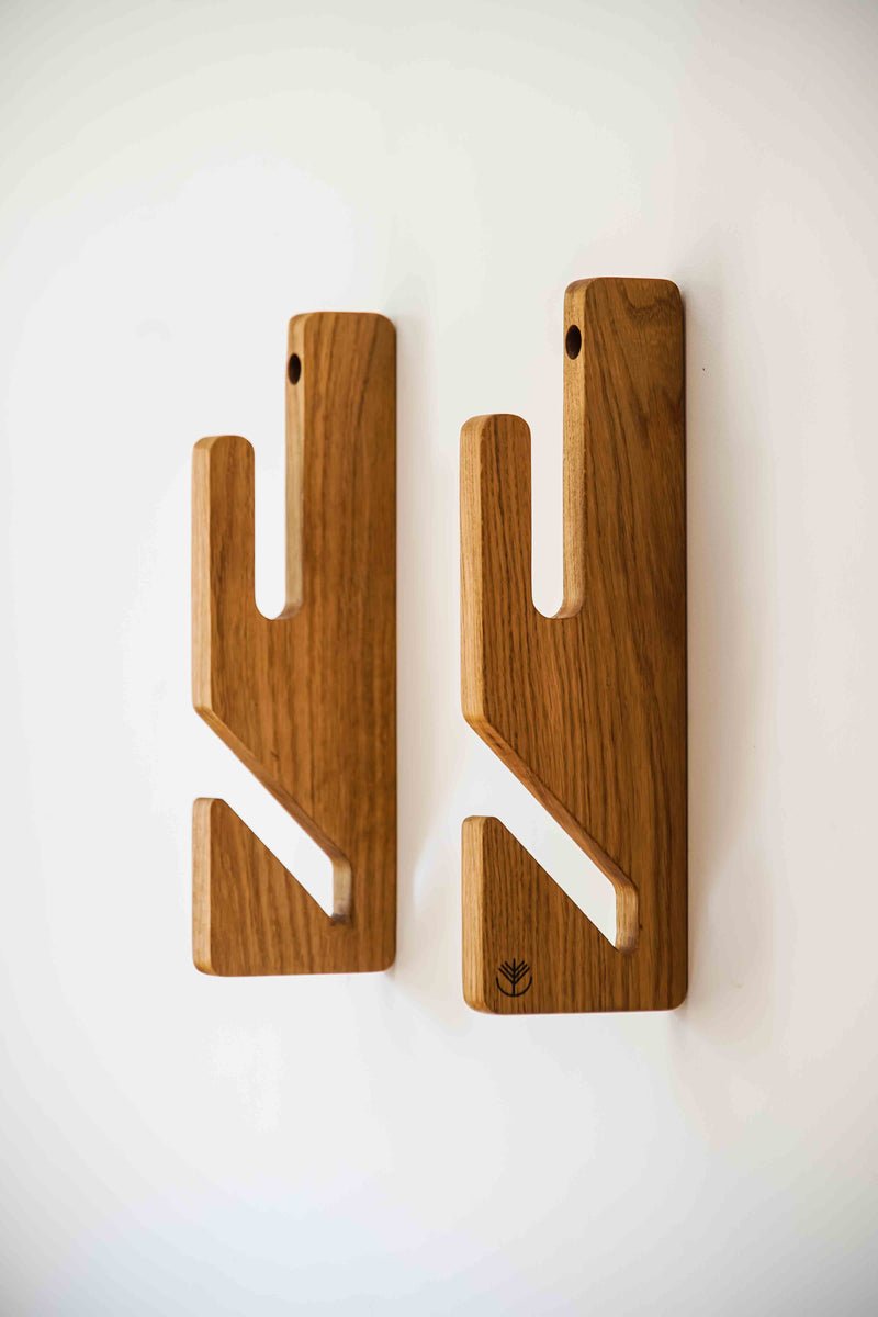 Oak double boardsport rack displaying two skateboards on the wall