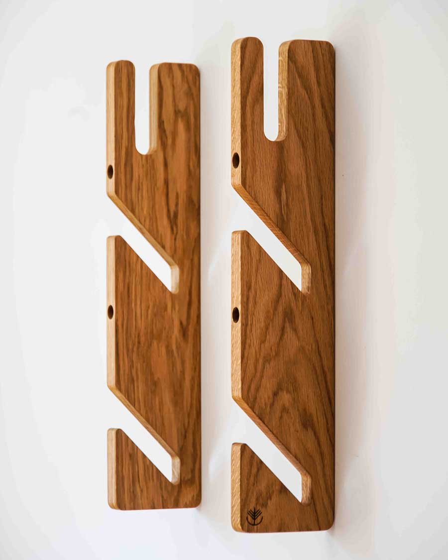Oak triple boardsport rack displaying three boards on one wall